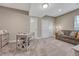 Comfortable bedroom featuring neutral walls, and carpet with a large closet and sofa at 4883 S Sicily St, Aurora, CO 80015