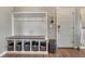 Organized entryway featuring built-in storage and a convenient seating area at 4883 S Sicily St, Aurora, CO 80015