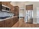 Well-equipped kitchen boasting stainless steel appliances and ample cabinet space at 4883 S Sicily St, Aurora, CO 80015