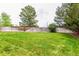 Expansive backyard with a lush green lawn, fully fenced for privacy, and ample space for recreation at 21396 E Prentice Ln, Centennial, CO 80015