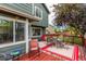 Backyard deck with seating and green siding of the house at 21396 E Prentice Ln, Centennial, CO 80015