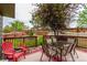 Backyard deck with outdoor dining and grass at 21396 E Prentice Ln, Centennial, CO 80015
