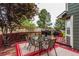 Backyard deck with a grill and outdoor dining with a fence at 21396 E Prentice Ln, Centennial, CO 80015