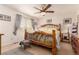 Cozy bedroom featuring a unique wooden bed frame, soft lighting, and neutral decor at 21396 E Prentice Ln, Centennial, CO 80015