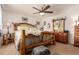 Comfortable bedroom featuring a unique wooden bed frame, soft lighting, and neutral decor at 21396 E Prentice Ln, Centennial, CO 80015
