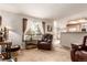 Spacious living area with comfortable seating, bright windows, and an inviting layout for relaxation and social gatherings at 21396 E Prentice Ln, Centennial, CO 80015
