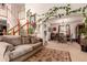 Inviting living room features a staircase, comfortable sofa, and dining area, perfect for relaxation and entertaining at 21396 E Prentice Ln, Centennial, CO 80015