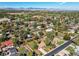 Aerial view of houses and neighborhood with mountain views in the background at 867 S Everett St, Lakewood, CO 80226