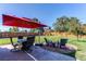 Outdoor patio with seating area, fire pit, and umbrella at 867 S Everett St, Lakewood, CO 80226