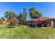 Large backyard with patio, fire pit, and green grass at 867 S Everett St, Lakewood, CO 80226