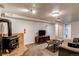 Finished basement with wood stove and TV area at 867 S Everett St, Lakewood, CO 80226