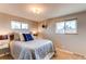 Bright bedroom with neutral walls, carpet, and ample natural light at 867 S Everett St, Lakewood, CO 80226