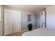 Bright bedroom with double door closet and carpet at 867 S Everett St, Lakewood, CO 80226