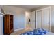 Bedroom with built-in shelving and carpet flooring at 867 S Everett St, Lakewood, CO 80226