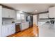 Modern kitchen with white cabinets, granite countertops, and stainless steel appliances at 867 S Everett St, Lakewood, CO 80226