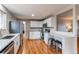 Updated kitchen featuring white cabinets and granite countertops at 867 S Everett St, Lakewood, CO 80226