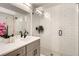 Modern bathroom with a glass-enclosed shower, sleek fixtures, and a stylish vanity with subway tile at 1433 Xavier St, Denver, CO 80204