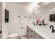 Contemporary bathroom with double sinks, gray cabinets, and modern fixtures complemented by elegant accents and finishes at 1433 Xavier St, Denver, CO 80204