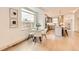 Cozy dining area next to the kitchen with modern chairs and a circular table near a large window at 1433 Xavier St, Denver, CO 80204