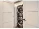 Conveniently located, this stacked washer and dryer are concealed by a sleek, modern door at 1433 Xavier St, Denver, CO 80204