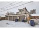 The rear of the property features an oversized four car garage and roof decks on the main house at 1433 Xavier St, Denver, CO 80204