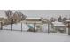 This rooftop patio is covered in snow but provides a wonderful elevated view of the neighborhood at 1433 Xavier St, Denver, CO 80204