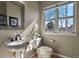 This powder room has updated fixtures, and lots of natural light at 5421 Potentilla Ct, Parker, CO 80134