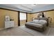 Bedroom with carpet floors, neutral walls, large window, modern decor, and accent lighting at 5421 Potentilla Ct, Parker, CO 80134