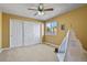 Bedroom with a ceiling fan, double sliding door closet, and a window at 5421 Potentilla Ct, Parker, CO 80134