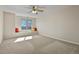 Bedroom features carpet floors, neutral walls, window seat, and ceiling fan with lights at 5421 Potentilla Ct, Parker, CO 80134