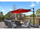 Inviting deck with comfortable seating, a fire pit, and scenic views of the surrounding landscape at 5421 Potentilla Ct, Parker, CO 80134