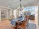 Open concept dining room with hardwood flooring, dining table and chairs and fireplace at 5421 Potentilla Ct, Parker, CO 80134