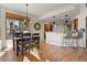 Dining room and kitchen with bar stool seating and a view to the backyard at 5421 Potentilla Ct, Parker, CO 80134