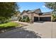 This lovely home features a three car garage and well manicured landscaping with mature trees at 5421 Potentilla Ct, Parker, CO 80134