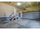 Spacious garage with concrete floors, stairs to interior, and automatic door at 5421 Potentilla Ct, Parker, CO 80134