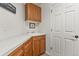 Laundry room with plenty of cabinets, countertop space, and a utility sink at 5421 Potentilla Ct, Parker, CO 80134