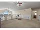 Upper level living room featuring vaulted ceilings, a ceiling fan, and great natural light at 5421 Potentilla Ct, Parker, CO 80134