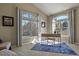 Bright office space with two large arched windows with desk and blue patterned rug at 5421 Potentilla Ct, Parker, CO 80134