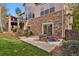 Cozy stone patio with outdoor seating and a stone fire pit, perfect for entertaining at 5421 Potentilla Ct, Parker, CO 80134