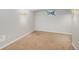 Unfinished basement with neutral carpet, small window, and modern wall-mounted lighting at 8727 E Girard Ave, Denver, CO 80231