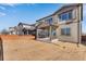 The backyard with the patio and outdoor living space offers great privacy and plenty of room for entertaining at 13398 E 99Th Pl, Commerce City, CO 80022