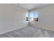 Inviting bedroom with two windows, carpet, and neutral walls offering natural light and a cozy atmosphere at 13398 E 99Th Pl, Commerce City, CO 80022