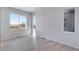 Bright bedroom with luxury vinyl flooring and two large windows offering natural light and beautiful views at 13398 E 99Th Pl, Commerce City, CO 80022