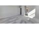 Spacious carpeted bedroom with ensuite bath and neutral decor with modern doors leading to other spaces at 13398 E 99Th Pl, Commerce City, CO 80022