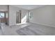 Neutral-toned bedroom featuring a view to the ensuite bathroom with tiled shower and carpet at 13398 E 99Th Pl, Commerce City, CO 80022