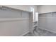 Walk in closet with a carpeted floor and storage racks at 13398 E 99Th Pl, Commerce City, CO 80022