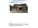 Exterior elevation of a two-story home with a two-car garage, complemented by meticulous landscaping at 13398 E 99Th Pl, Commerce City, CO 80022