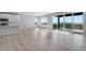 Open living space combining kitchen and living room featuring views of the outdoors at 13398 E 99Th Pl, Commerce City, CO 80022
