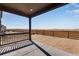 Covered patio looks out onto the yard, creating a seamless transition between indoor and outdoor living spaces at 13398 E 99Th Pl, Commerce City, CO 80022