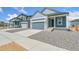 Charming two-story home with stone accents and well-maintained gravel landscaping at 9343 Biscay St, Commerce City, CO 80022